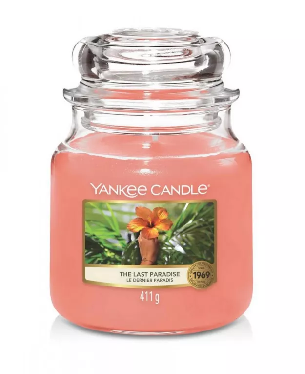 Średnia świeca zapachowa w szklanym słoiku z pokrywką YANKEE CANDLE o zapachu  The Last Paradise