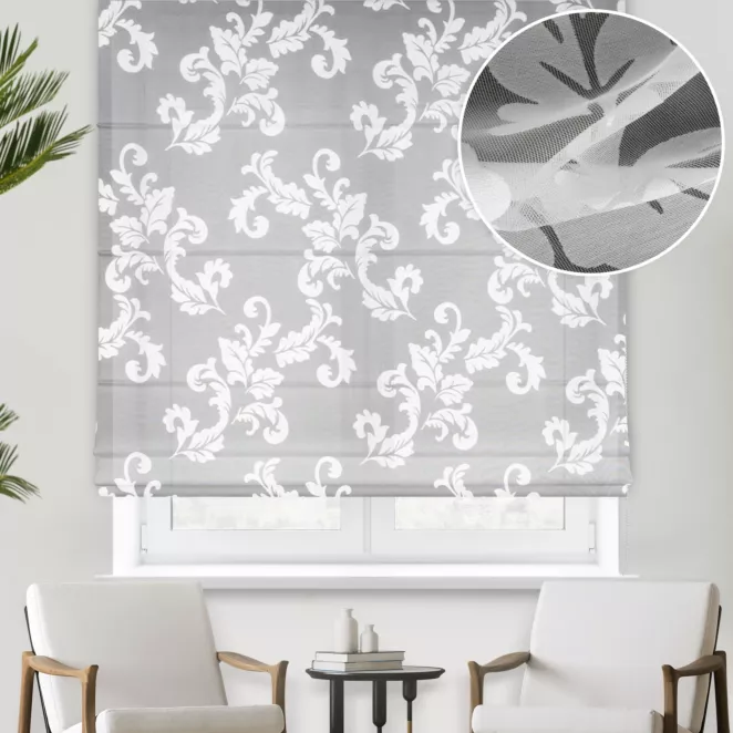 Roleta rzymska biała z ekskluzywnej tkaniny organtynowej z wzorem roślinnym, wykończona obciążnikiem