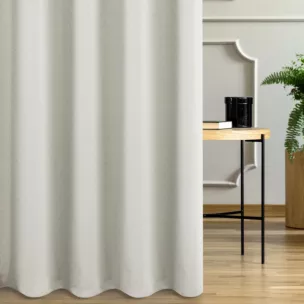 Zasłona szyta na flexach kremowo złota z gładkiej tkaniny przeplatanej błyszczącą lureksową nicią o wzorze w kropki