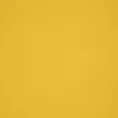 Roleta rzymska żółta z gładkiej tkaniny zaciemniającej typu dimout wykończona obciążnikiem