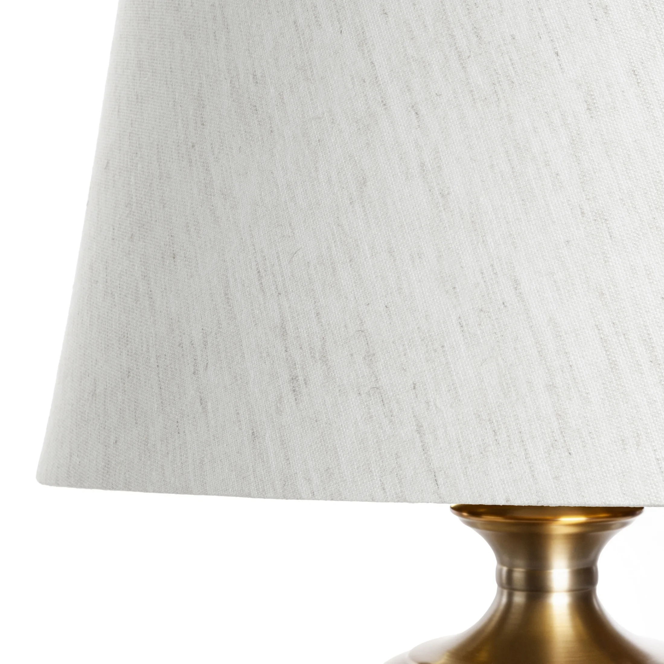 Lampa stołowa do salonu biało, złota AMARI zdobiona szklaną podstawą i lekko szenilowym abażurem Eurofirany