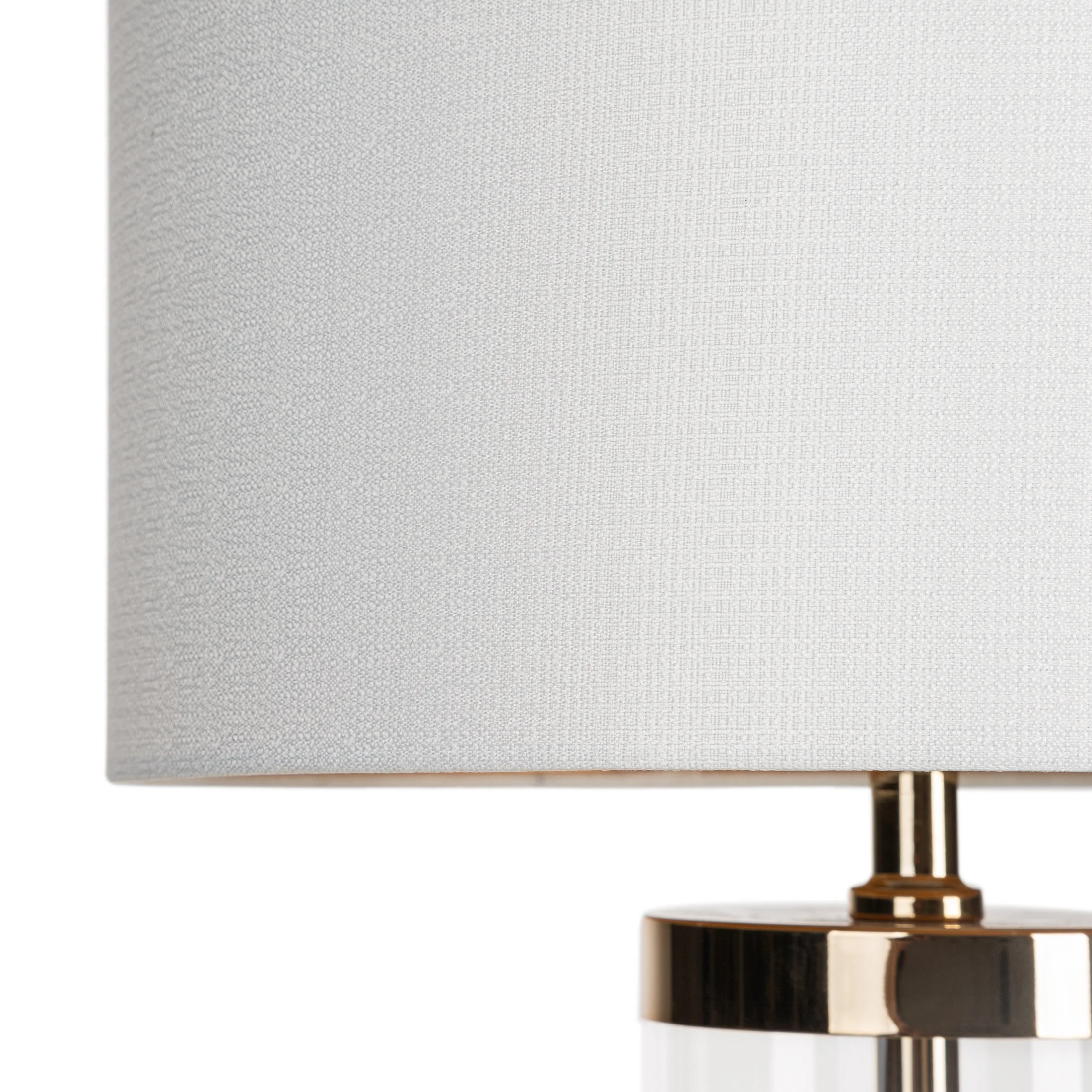 Lampa stołowa do salonu biała ELIANA z subtelną szklaną podstawą i złotymi akcentami Eurofirany