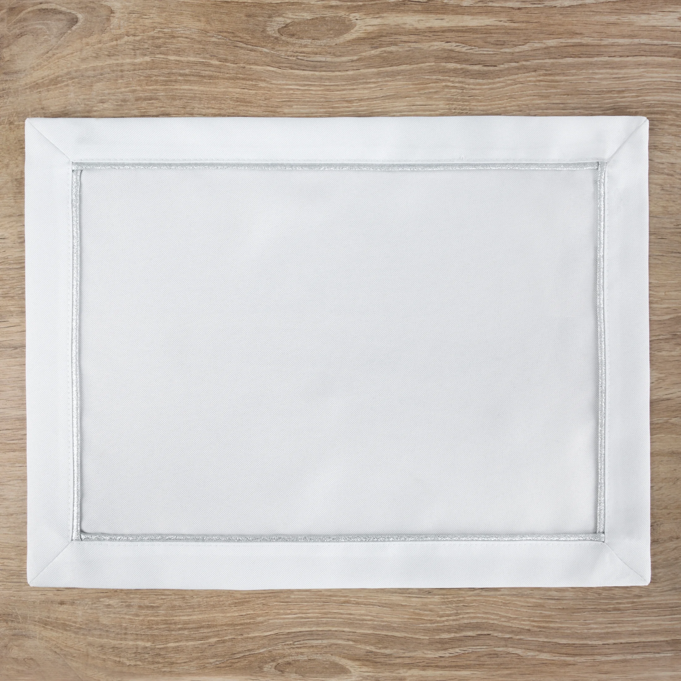 Komplet podkładek 4 szt białych 30x40 cm MADELE ze srebrną lamówką